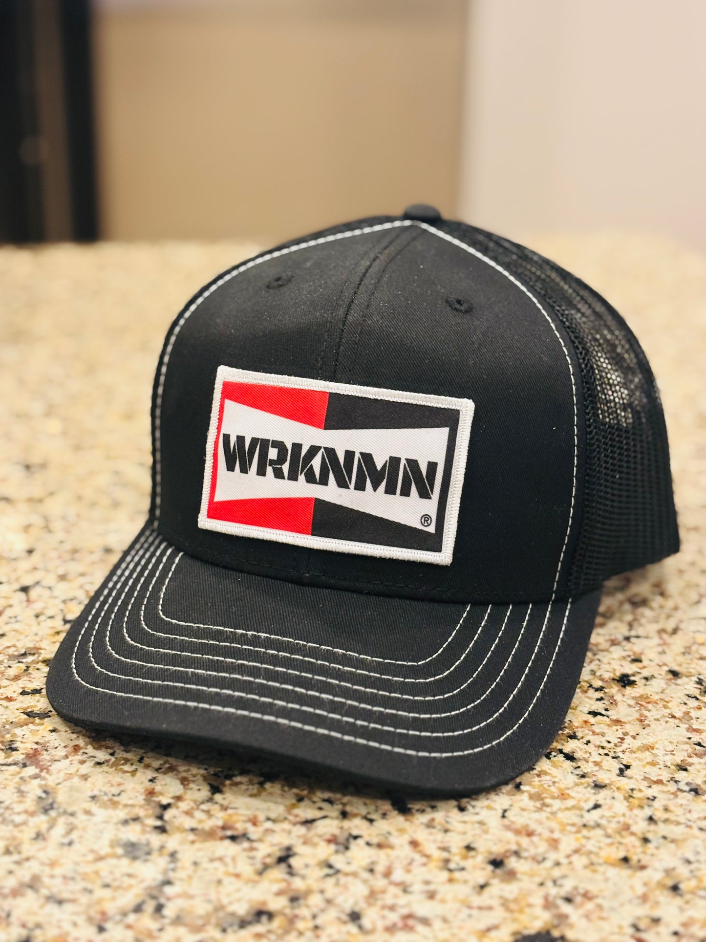A classic 1970's throwback WRKNMN truckers hat.