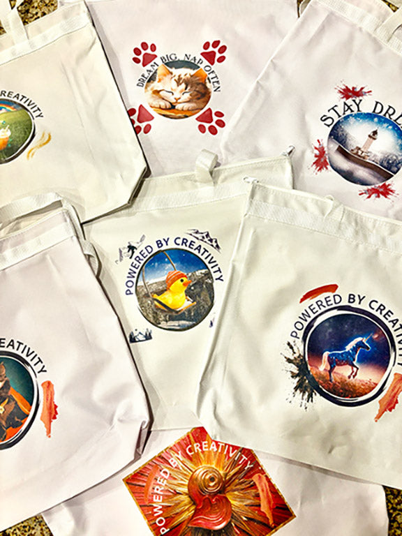 Tote bags that were live printed onsite at a conference or convention directly from the best live event printing team, The Silk Screen Machine