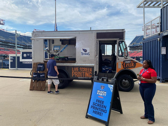 Screen printing truck in Nashville, TN, Live Screen Printing at the Tennessee Titans stadium for season ticket holders.