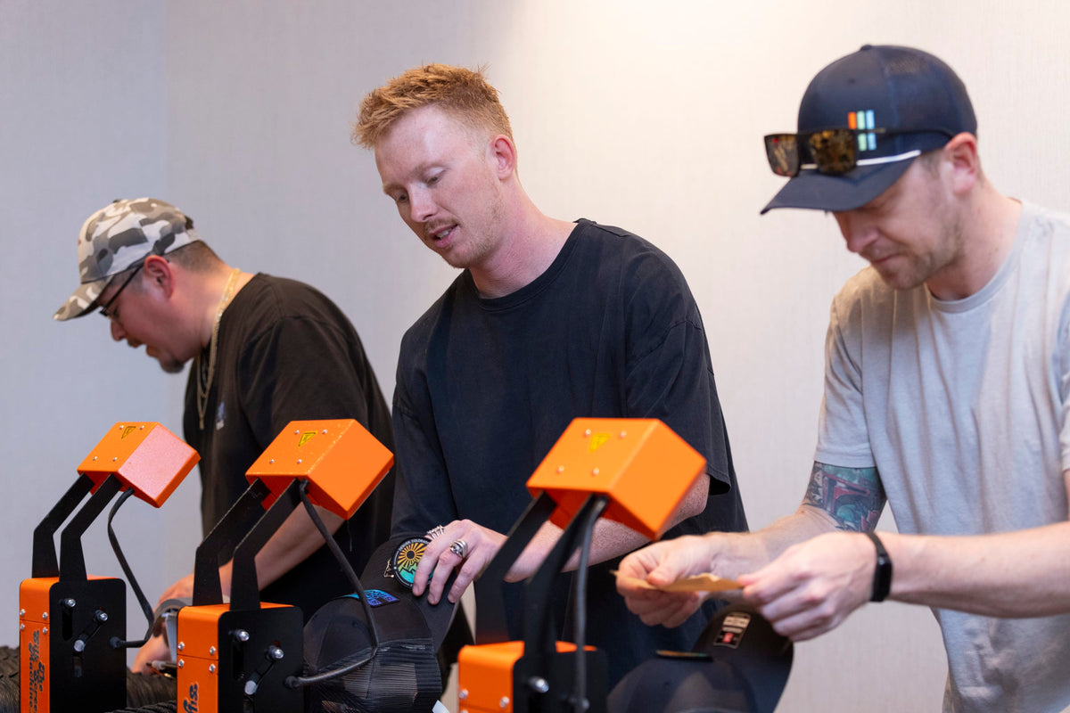 Three men working a Live Custom Hat Bar party for fortune 500 company's private event in Los Angeles, California.