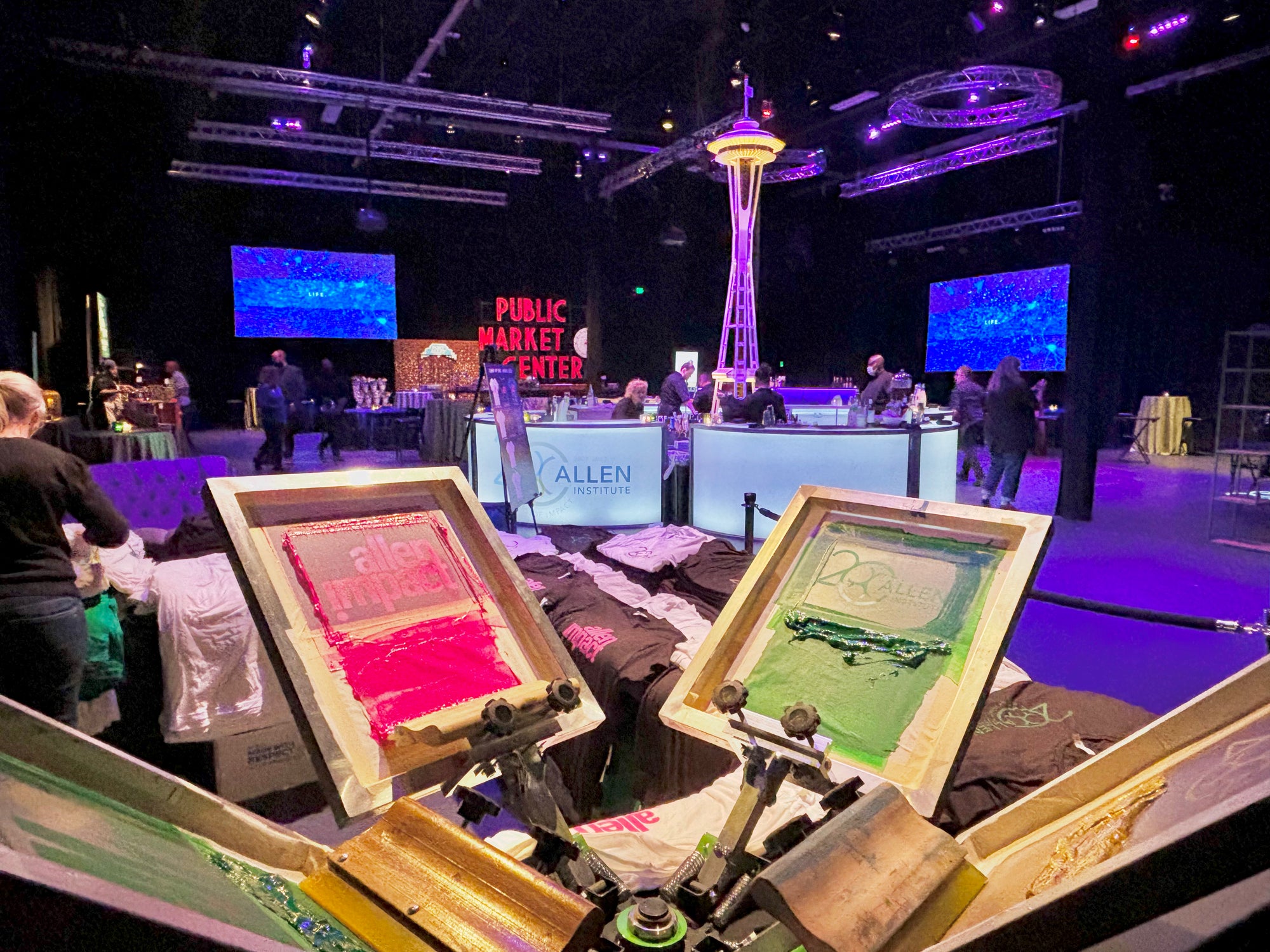 A large event space with live holiday screen printing Corporate Gifts for employees. Christmas company party in Seattle, Washington.